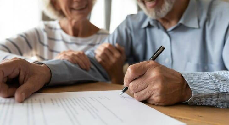 Senior couple signing estate planning documents with support from a legal firm near me—trusted legal assistance and legal document preparation services near me in Santa Clara County.