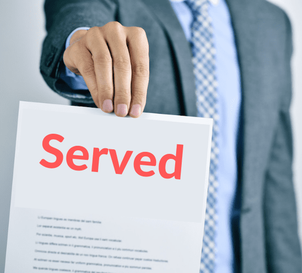 What Tenants Can Expect When Facing Eviction in California — And How to Get Legal Help Fast 1 Eviction notice being served to tenant at residential property in San Jose, California, representing legal eviction process under California law.