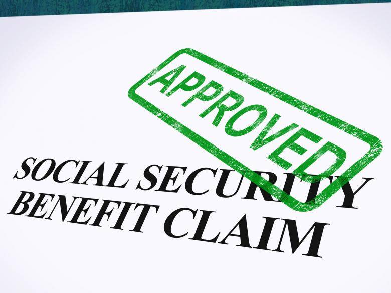 A Social Security benefit claim form stamped with “APPROVED” in green, representing successful Social Security Disability assistance.