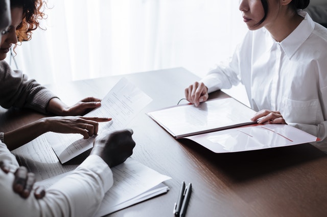 Clients reviewing family court documents with a legal document assistant during a consultation