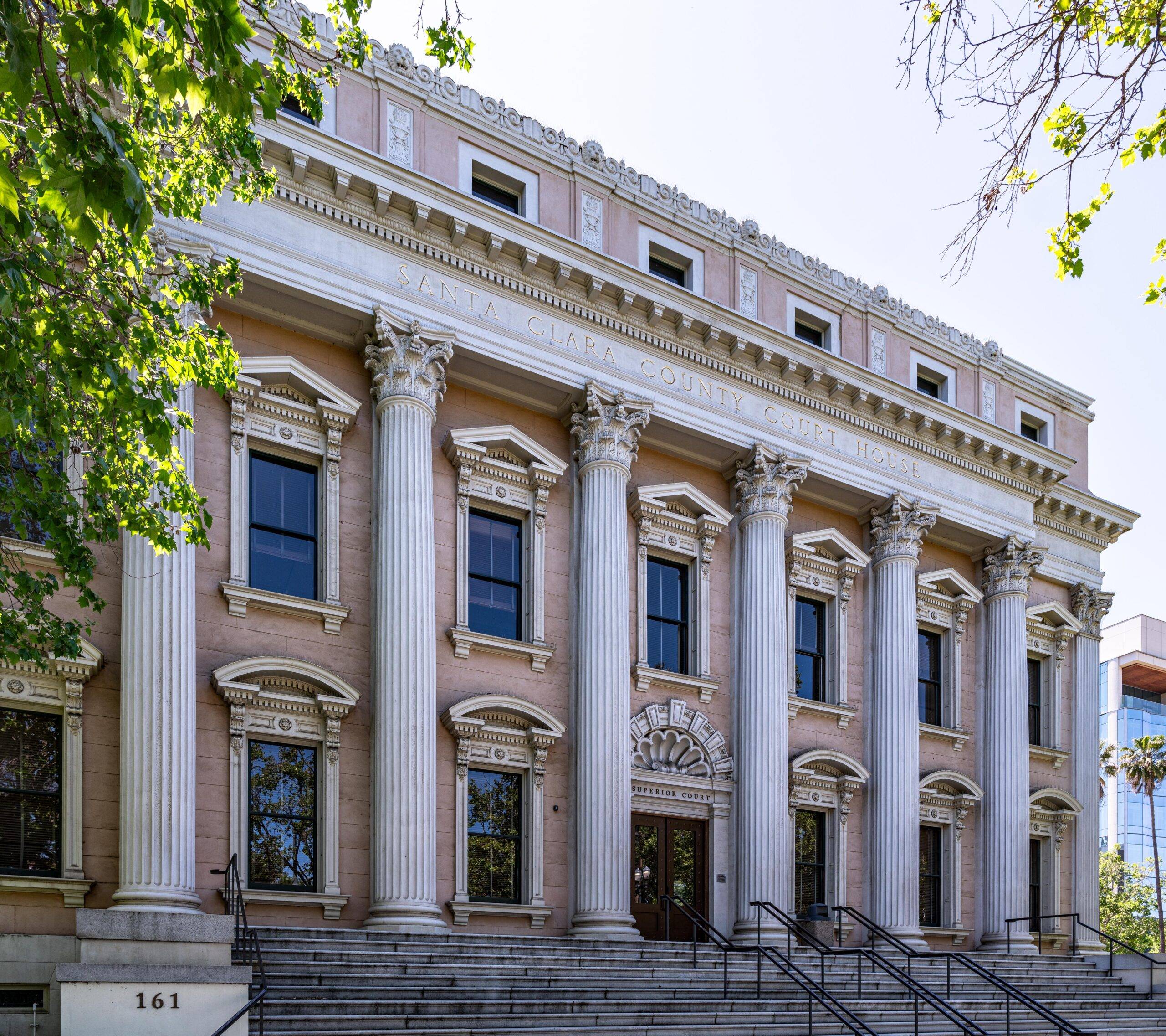 Santa Clara County Courthouse in San Jose, California, featuring classical columns and grand entrance steps.
