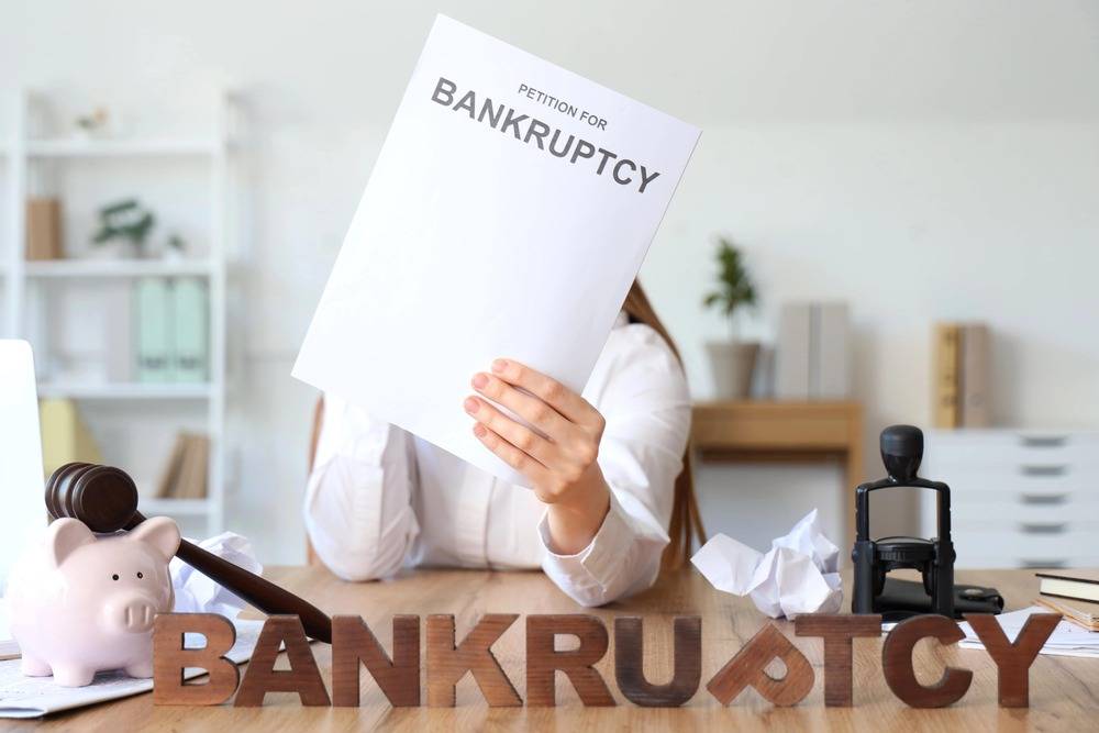 Person holding bankruptcy petition document
