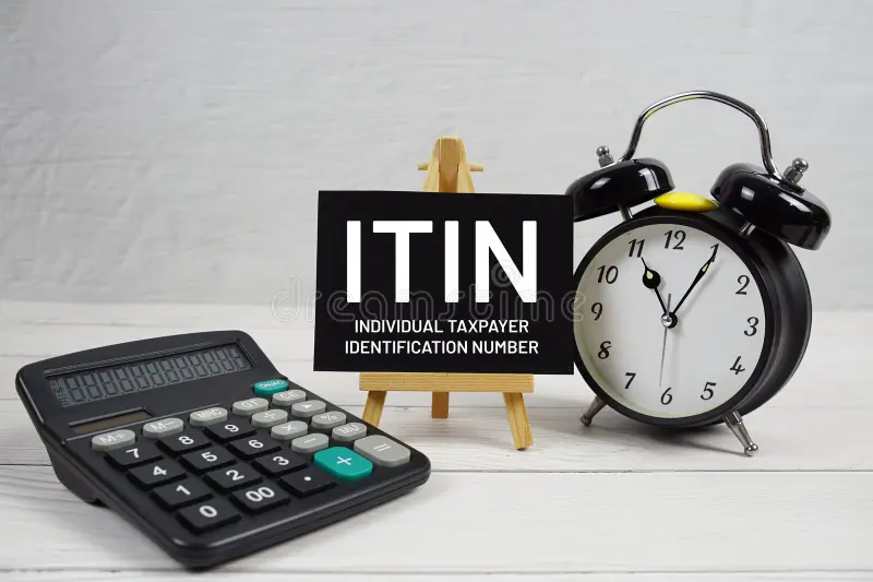 Calculator, clock, ITIN sign displayed.