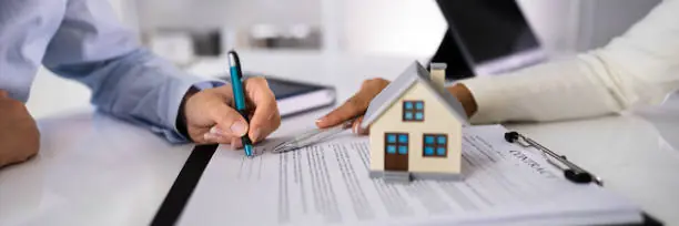 Property deed transfer with house model