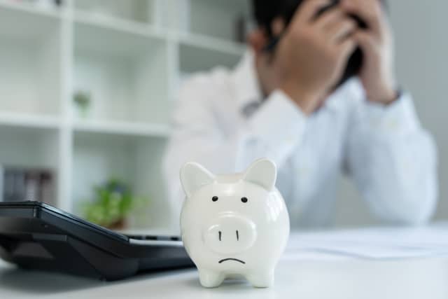 Woman stressed over money and credit card debt beginning Chapter 7 bankruptcy process in San Jose